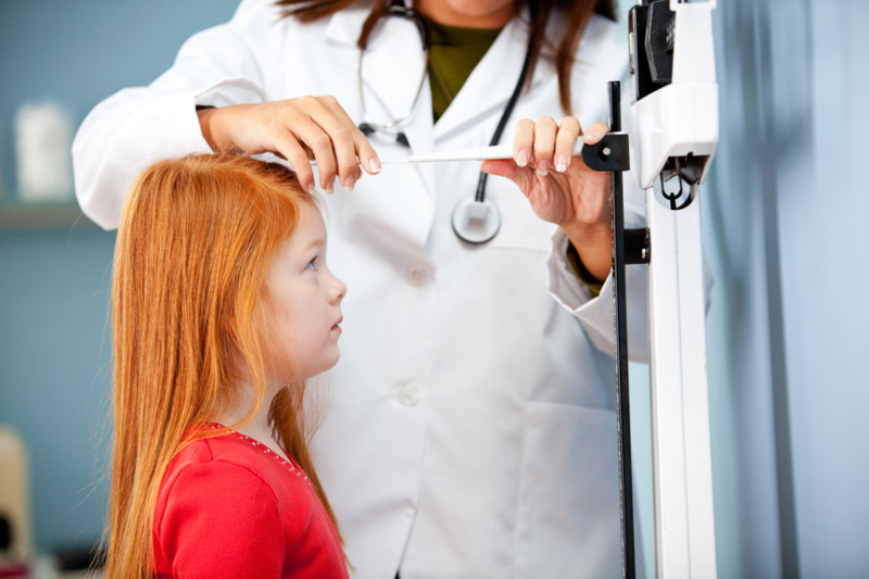 Exam Room: Girl Has Height Measured By Pediatrician